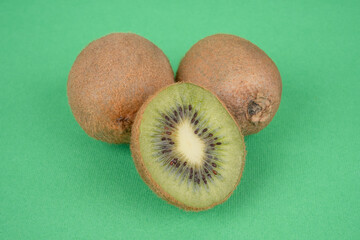 kiwi fruit on green background