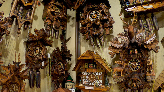 Rothenburg ob der Tauber, Bavaria, Germany - December 8, 2021: Vintage cuckoo clocks on the wall.