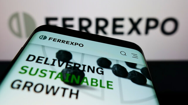 Stuttgart, Germany - 01-29-2022: Smartphone with website of Swiss commodity trading company Ferrexpo plc on screen in front of business logo. Focus on top-left of phone display.