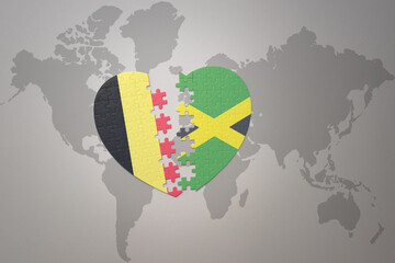 puzzle heart with the national flag of belgium and jamaica on a world map background.Concept.