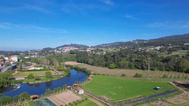 Aerial view of small waterfall on the Ave River in Santo Tirso, Portugal.