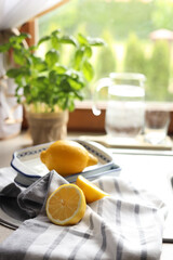 Fresh ripe lemons on countertop in kitchen, space for text