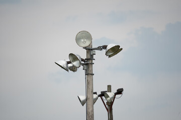 Baseball field lights in cloudy sky