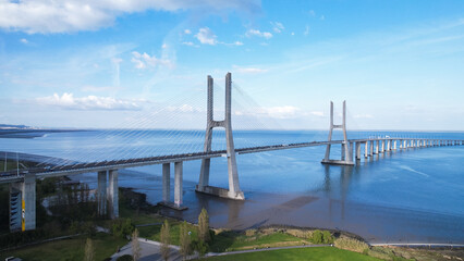 Aerial view of the Vasco da Gama Bridge is a cable-stayed bridge located in the city of Lisbon in Portugal and crosses the Tagus River. It is the second-longest bridge in Europe.