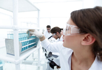 Young woman with test tubes in the laboratory