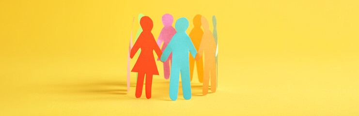 Paper human figures making circle on yellow background, banner design. Diversity and Inclusion...