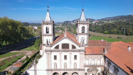 Fototapeta na wymiar Aerial view of the Monastery of St. Benedict (Sao Bento) in the city of Santo Tirso, Portugal, with the Ave River in the background. Benedictine order.