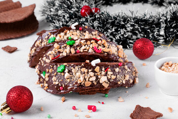 Sweet tacos with chocolate waffle and ice cream topped with Christmas sprinkles and nuts on the...