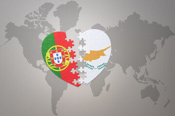puzzle heart with the national flag of portugal and cyprus on a world map background.Concept.