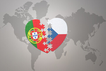 puzzle heart with the national flag of portugal and czech republic on a world map background.Concept.