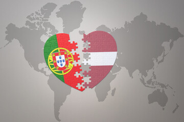 puzzle heart with the national flag of portugal and latvia on a world map background.Concept.