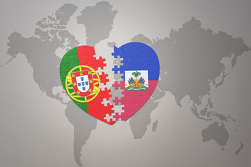 puzzle heart with the national flag of portugal and haiti on a world map background.Concept.