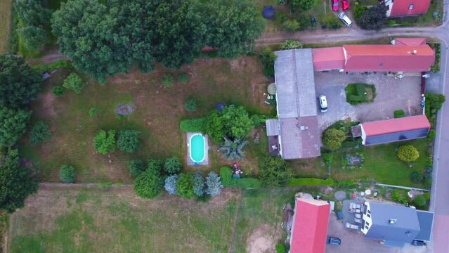 country living, pool, garden
Stunning aerial view flight bird's eye view drone footage at Countryside village Hainichen in Europe Saxony Anhalt, summer 2022. 4k Cinematic from above by Philipp Marnitz