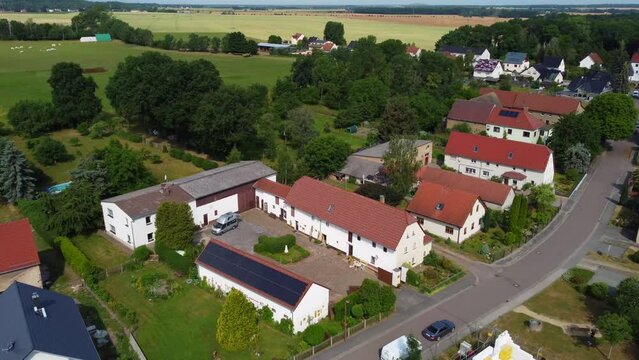 A horse farm Vacation in the country.
Marvelous aerial view flight Drone top-down view
at Countryside village Hainichen in Europe Saxony Anhalt, summer 2022. 4k Cinematic from above by Philipp Marnitz