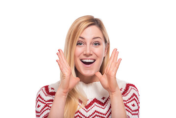 Young surprised joyful woman in winter clothes on a white background.