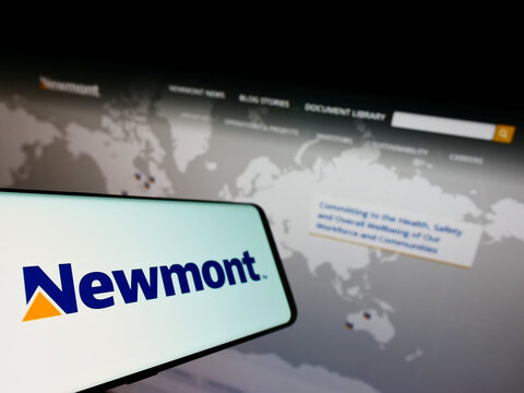 Stuttgart, Germany - 01-29-2022: Smartphone with logo of American gold mining company Newmont Corporation on screen in front of business website. Focus on left of phone display.