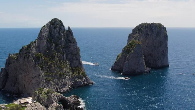 Picturesque Sea Stack Faraglioni Rocks on Coast of Capri Island, Italy - Aerial