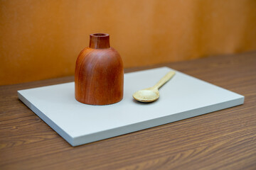 kitchen objects are arranged on the table with conceptual art. abstract compositions for decorating the living room or kitchen table. minimalist wood cooking tools.