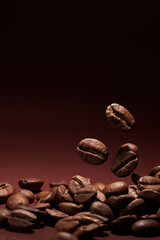 Roasted coffee beans closeup on brown gradient background