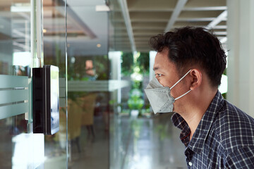 Access control facial recognition system. A man faces scanning the modern technology security ....