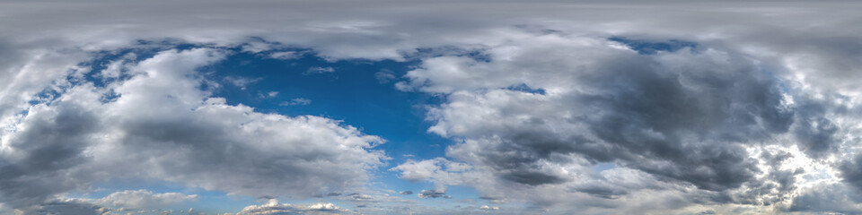 Seamless overcast blue sky hdri panorama 360 degrees angle view with zenith and beautiful clouds for use in 3d graphics as sky replacement and sky dome or edit drone shot.