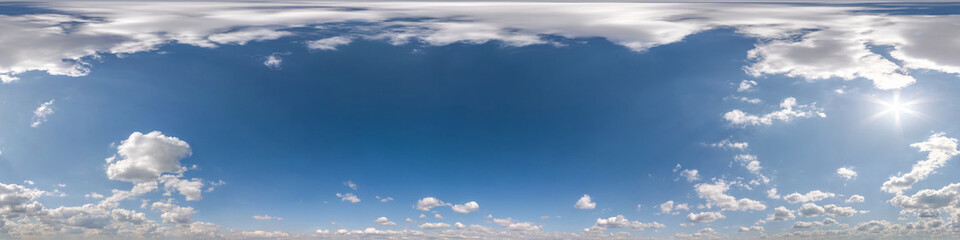 Seamless overcast blue sky hdri panorama 360 degrees angle view with zenith and beautiful clouds for use in 3d graphics as sky replacement and sky dome or edit drone shot.