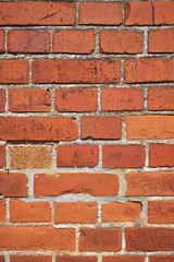 Closeup of weathered facebrick wall and copy space on exterior of a home, house or city building. Texture and detail background of rough architecture construction design of red brick on old structure