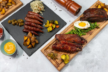 A banner with barbecue and fried sausages corn potatoes meat cooked on fire grilled meat
