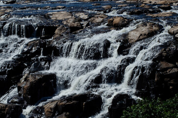 Waterfall of Piracicaba River. River almost dry. River with visible stones. River of a turistic place.
