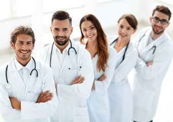 medical team standing with arms crossed on a white background