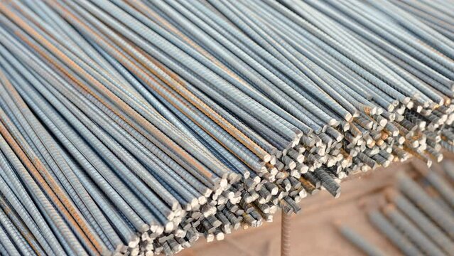 4k, A large number of rebars were cut into pieces to prepare for use in the construction of buildings piled up at the construction site.
