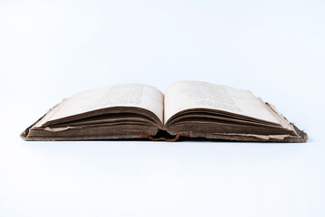 Opened old book on a white background.
