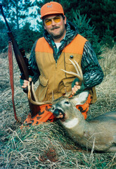 A hunter with a trophy white-tailed buck 