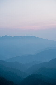 wide view layer of mountain with sunrise background © tickcharoen04
