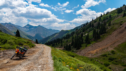 Motorcycle ready to ride on Animas Mountain Loop Trail   an iconic off-highway vehicle (OHV) trail through the mountains  of Colorado  concepts of adventure and road less traveled  © Michelle