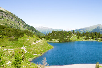 Alpine lake landscape. Rolle pass area, dolomites