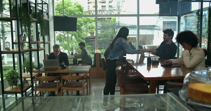 Coffee shop environment. Customers inside cafe