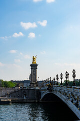 View of the Alexander III Bridge and the golden statues