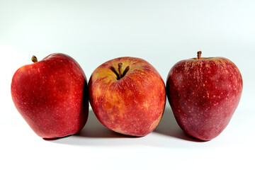 Three apples on white background.