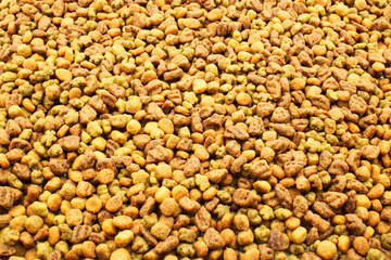 Dog or cat food, kibble on a white background