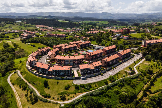 Aerial view of a residential district with houses on hilltop in Comillas, Cantabria, Spain.