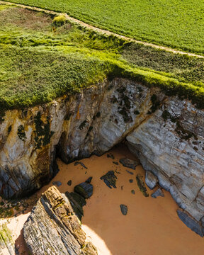 Aerial view of wild coastline with cliffs near Playa de Serantes, Tapia de Casariego, Asturias, Spain.