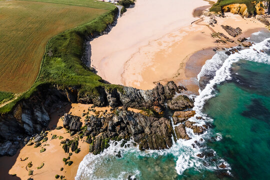 Aerial view of wild coastline with cliffs near Playa de Serantes, Tapia de Casariego, Asturias, Spain.