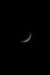 Obraz na płótnie Canvas Waxing crescent moon in the night sky