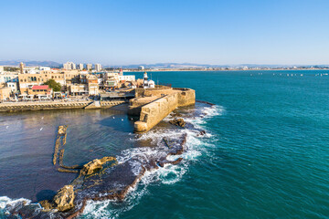Aerial View of old medieval port and lagoon in Acre, Northern District, Israel.