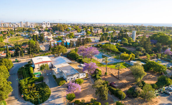 Aerial View of city Rasko Haklait with trees, Sa'ar, Northern District, Israel.
