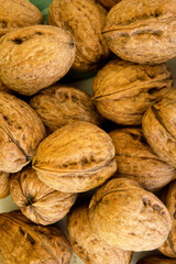 Closeup shot of a stack of walnuts.