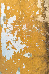 Texture of old yellow concrete wall for background. Cracked concrete wall.