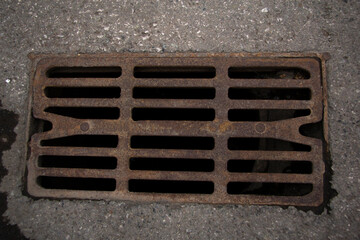 Storm Sewer. Cast iron rusty grate