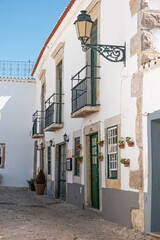 Fototapeta na wymiar Small street in the old town of Faro in Algarve region, south of Portugal.